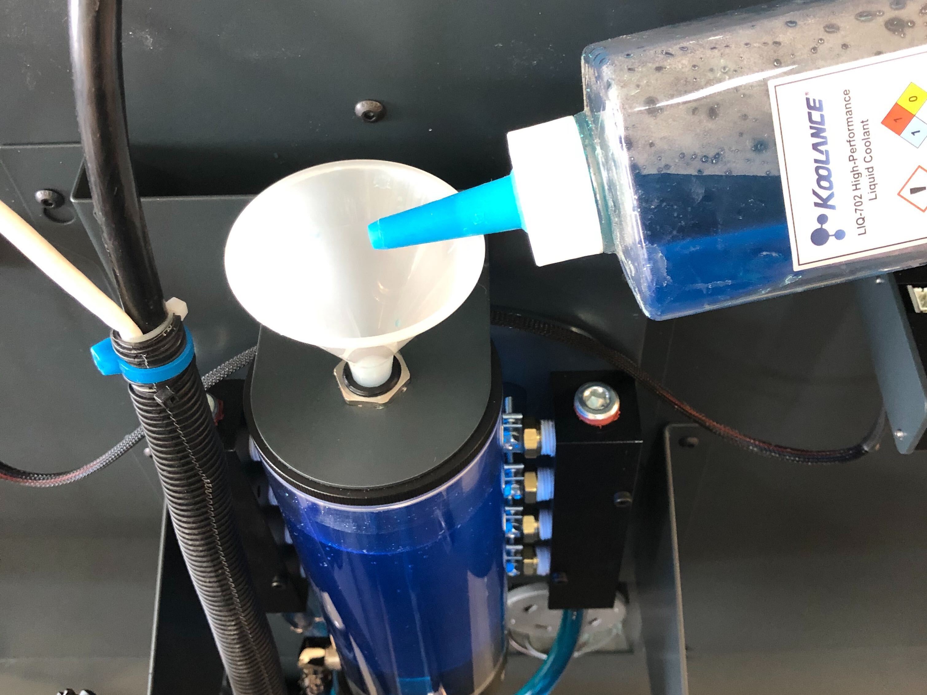 Pour coolant into reservoir